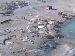 Aerial people bathing in the Dead sea, Judea Desert, Israel Stock Footage