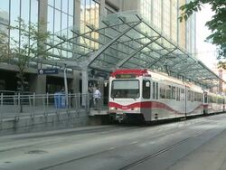 WS Streetcar arriving to  station  / Calgary, Alberta, Canada Stock Footage