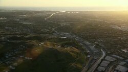 Aerial view of coastal Los Angeles County, tilting down to the Baldwin Hills. Stock Footage