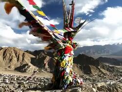 MS Shot of Buddhist prayer flags flying above Leh town / Ladakh, India Stock Footage