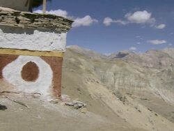 MS PAN Villager painting top of buddhist chorten tower / Saldang village, High Himalayas, Upper Dolpo near Tibetan border, Nepal  Stock Footage