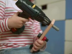 Little Boy Playing With A Drill Toy Stock Footage