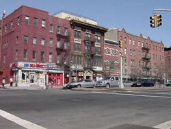 WS Busy intersection in front of MGI in Harlem / New York, United States Stock Footage