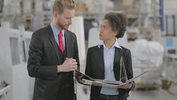 Quality inspectors checking catalogs and brochures Stock Footage