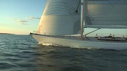Passengers on the deck of the large sloop Heroina enjoy an afternoon sail off Newport, Rhode Island. Stock Footage