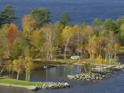WS ARIEAL View of Small dock and houses at Moosehead lake bank / Maine, United States Stock Footage