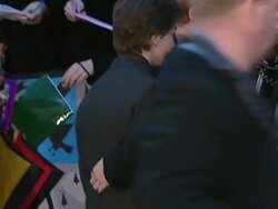 Daniel Radcliffe signing autographs at the Premiere of Harry Potter and the Chamber of Secrets. News Clip