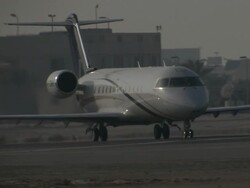 MS View of small jet heading directly towards  and turns /  Manamba ,Bahrain Stock Footage