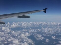 View out of plane window over clouds, some turbulence Stock Footage