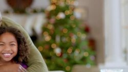 Father hugs and kisses daughter, smiles for camera in the kitchen (dolly-shot) Stock Footage
