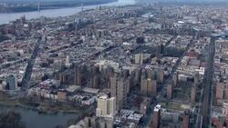 Aerial view of Harlem stretching from Central Park to the Hudson River. Stock Footage
