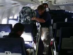 Immigration detainees board deportation flight Stock Footage
