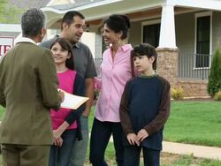 WS DS Family Having Discussion with Realtor in Front of New Home For Sale / Richmond, Virginia, USA Stock Footage