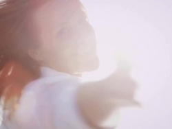 Woman spinning on beach Stock Footage