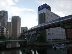 MS View of aerian subway with building and river with boat / Tokyo, Japan Stock Footage