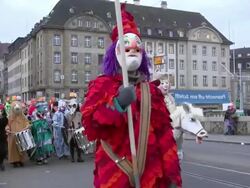 MS Shot of masked people walking on street and celebrating in Basel Carnival (Basler Fasnacht) / Basel, Switzerland Stock Footage