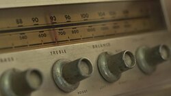 Hand adjusts radio channels recorder Stock Footage