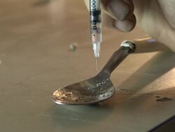 Anonymous Heroin User Preparing Needle News Clip