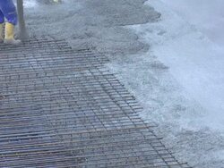 Worker Directing Concrete Onto The Construction Site Stock Footage