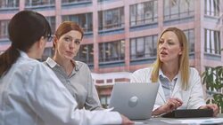 LD Two female doctors in meeting with project manager Stock Footage
