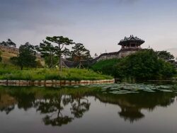 MS T/L Shot of Suwon Hwaseong Castles Banghwasuryujeong Lake and Building at sunset (UNESCO) / Suwon, Kyonggi-Do Province, South Korea   Stock Footage