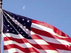 Handheld close-up shot of the American flag flying over the Korean War Veterans Memorial Stock Footage