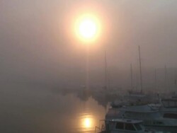 Winter: Push From Boats, Sun and Reflection into Fog Stock Footage