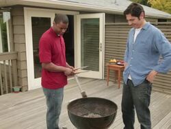 MS Two men preparing porch barbecue / Portland, Oregon, United States Stock Footage