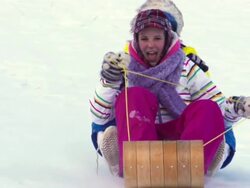 Young girls Tobogganing in Super Slow motion Stock Footage