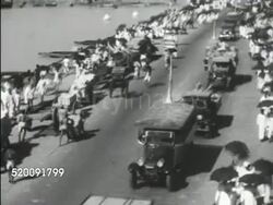 1934: CALCUTTA (KOLKATA): WS Silhouette of docked ship in harbor, HA TD Dock workers carrying goods up & down ramp. *HA TD Street scene, many people walking side of roadway, trucks moving down road. LA MS Many bare feet walking on wooden plank wal Instructional Video