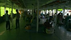 Sadarghat Launch Terminal in Dhaka Bangladesh is a bustling passenger transport hub where tiny wooden boat taxis paddle alongside huge steel ferries Stock Footage