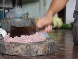 Man chops pork Stock Footage