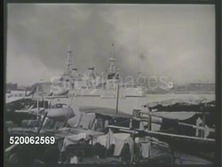 1937: CHINA: SECOND SINO-JAPANESE WAR: * VS Smoke rising from ships in harbor, including United States Navy cruisers (could be USS Augusta, unconfirmed). VS United States Navy soldiers on deck looking over map. MS US flag over casket. Killed in Action Instructional Video