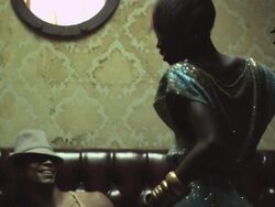 Man nodding to music in club, other people enter and start dancing Stock Footage