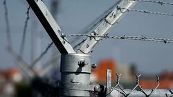 INSERT on barbed wire fence Stock Footage