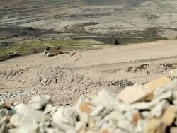 Large Truck loading coal mine to automatic conveyor Stock Footage