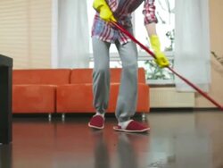 HD DOLLY: Teenage Girl Mopping The Floor Stock Footage