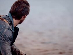 Backpacker resting at a lake Stock Footage