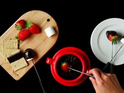 MS Hands coating strawberry with melted chocolate / Seoul, South Korea Stock Footage