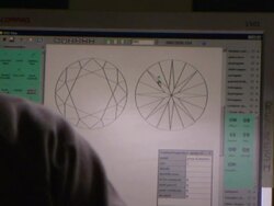 A gemcutter scrolls over geometric shapes with a mouse on a computer monitor. Stock Footage