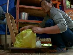 MS Nomad woman making cheese in Yurt / Central-south Mongolia, Mongolia Stock Footage