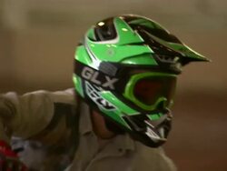 Close up of child as he drives through the course in an ATV. Stock Footage