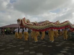 Mid shot of Chinese dragon dancers performing Stock Footage
