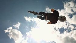 HD Super Slow-Mo: Dirt Backflipping Against Cloudy Sky Stock Footage