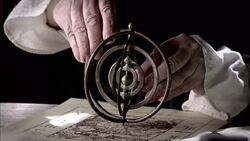 Nostradamus adjusts a gyroscope compass. Stock Footage