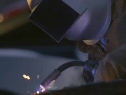 CU Man arc welding next to truck / Boulder City, Nevada, USA Stock Footage