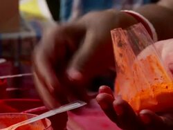 CU Vendor hands filling tika powder / Calcutta, West, Bengal India Stock Footage