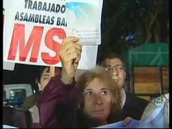 Reaction to resignation of economic minister + speculation on Duhalde's future + demos News Clip