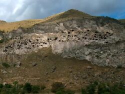 WS PAN Cloud flowing on vardzia cave town complex / Vardzia, Georgia Stock Footage