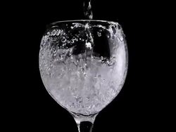 CU SLO MO Shot of Water being poured into glass / Calvados, Normandy, france Stock Footage
